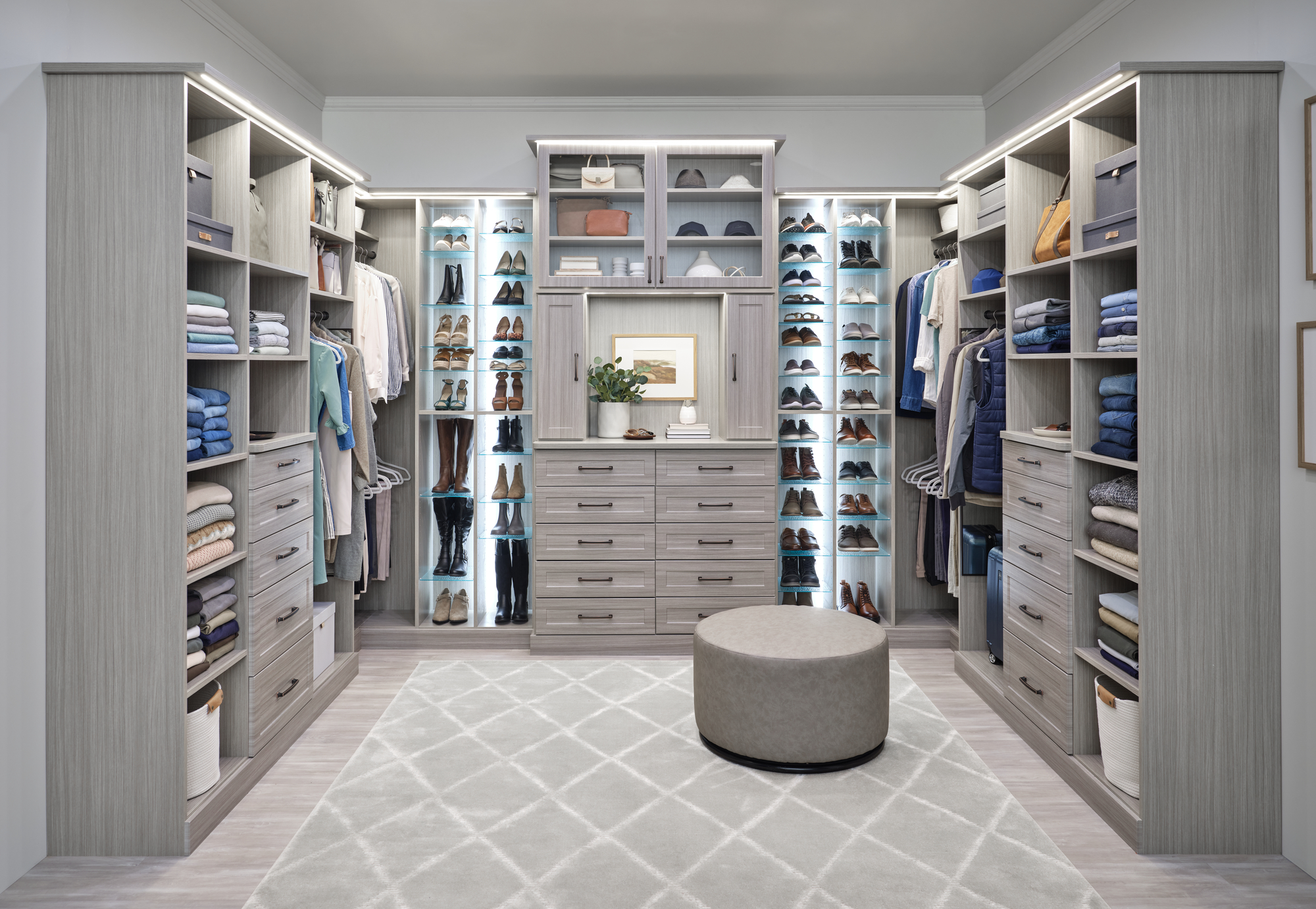 Large custom closet with new custom lighting and adjustable shoe shelves in timber grey