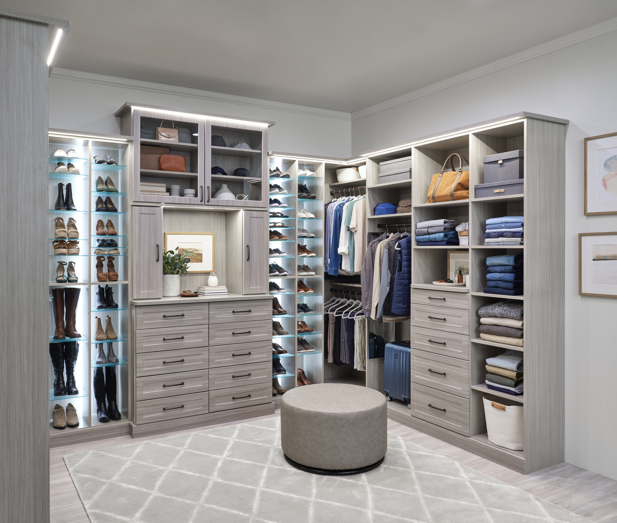 Large custom closet with custom lighting, drawers and adjustable shoe shelves in timber grey