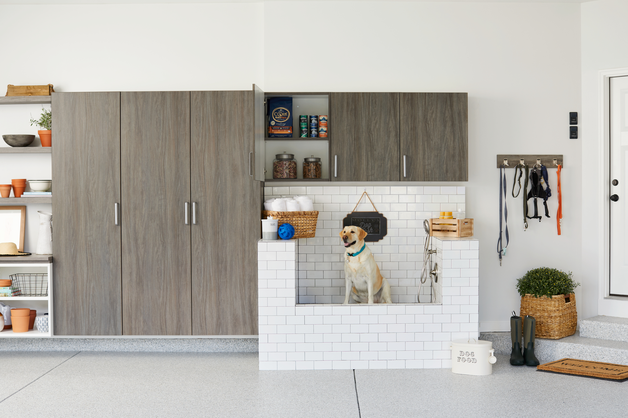 Garage entryway with dog bath from Inspired Closets