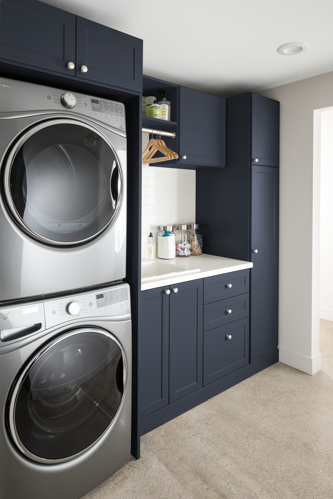 Navy blue laundry room storage system from Inspired Closets