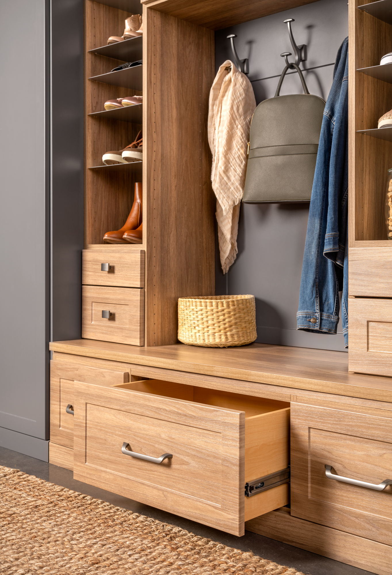Pulled out storage drawers from an Inspired Closets entryway system