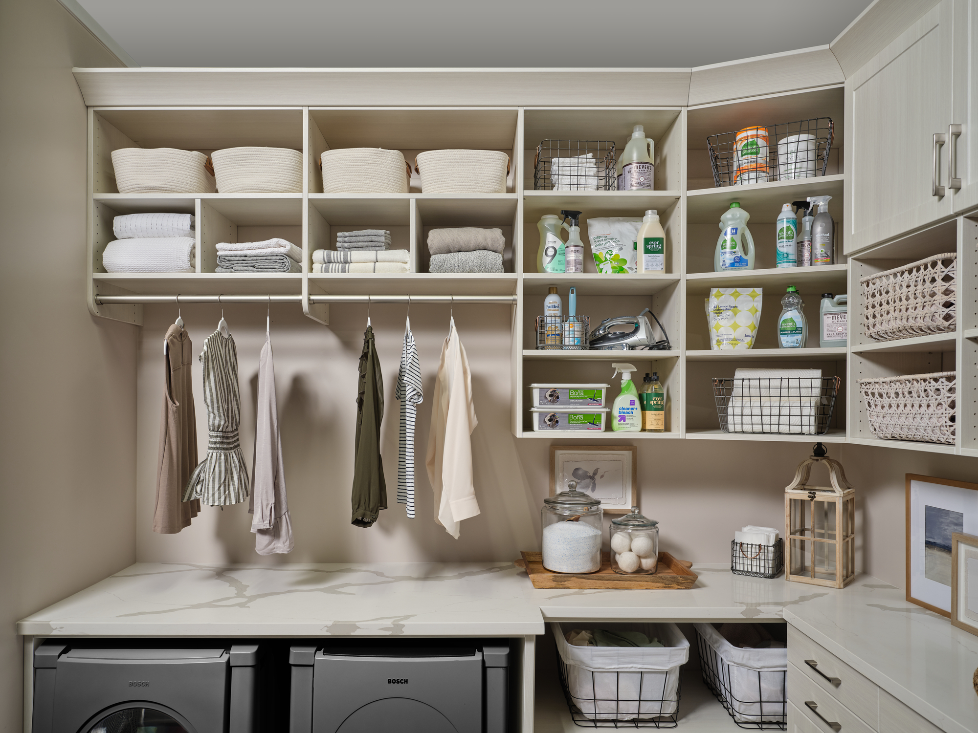 Laundry room in morning mist with hanging storage and folding station