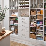 Basket, sheet pan and wine storage in a white Inspired Closets pantry