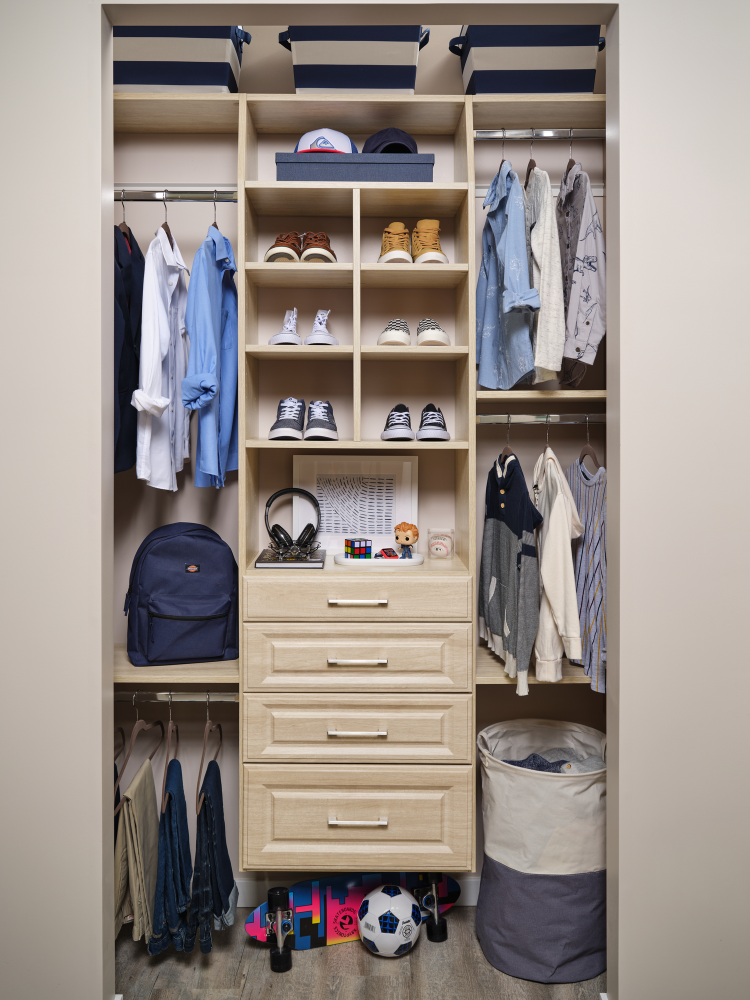Closet with for hanging storage for a young boys cloths from Inspired Closets