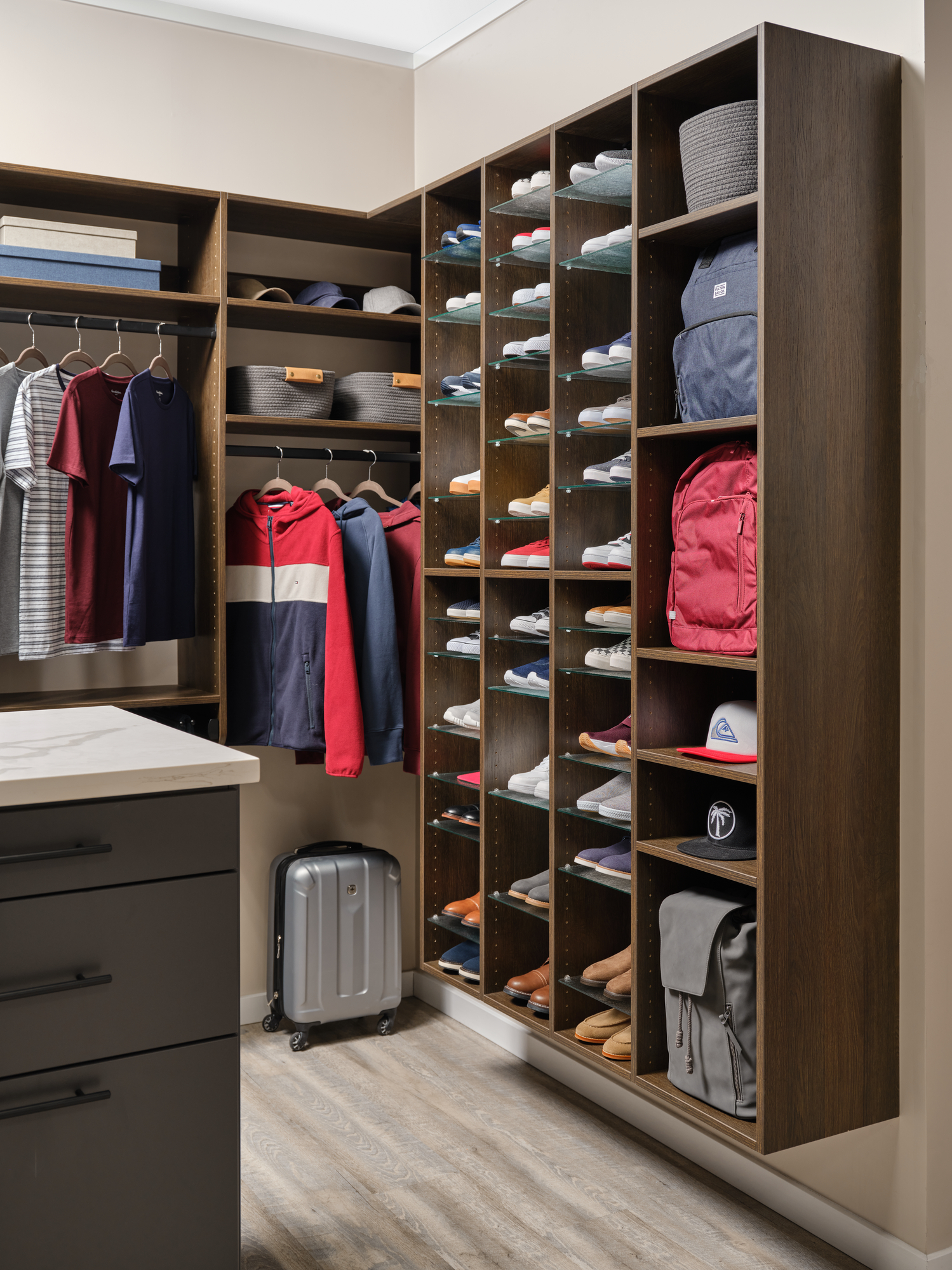 Adjustable shoe storage and bag storage for men's walk-in from Inspired Closets