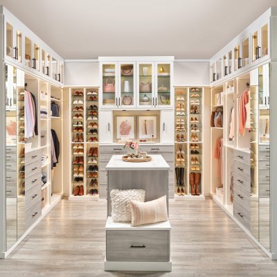 Two toned boutique closet with white and River Rock from Inspired Closets