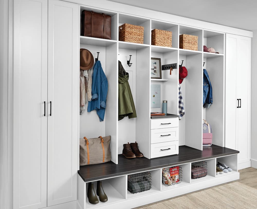 White entryway with locker systems and cupboard storage for Inspired Closets