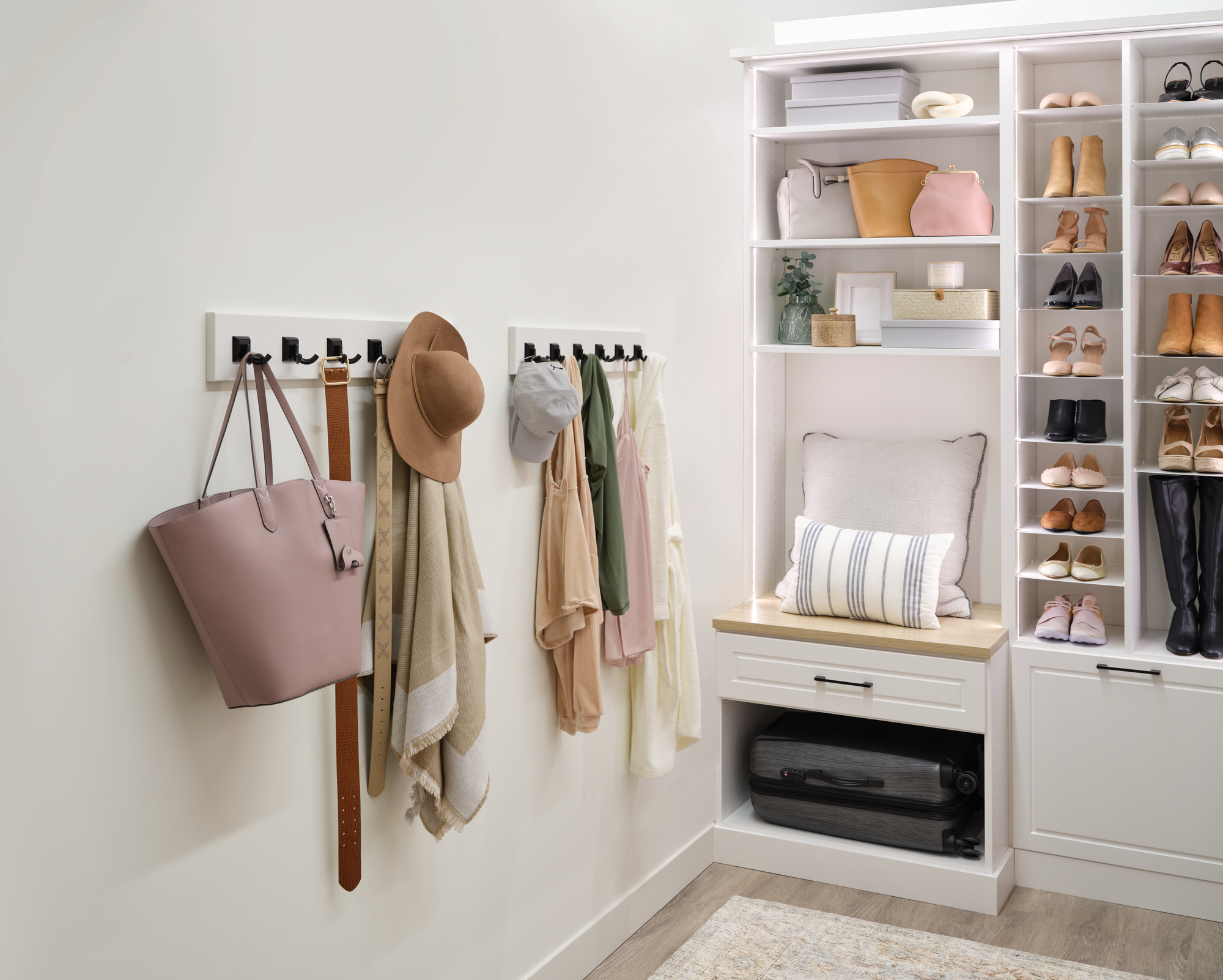 Hook storage and bench for white women's walk-in closet