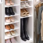 Adjustable shoe storage for a white women's walk-in closet from Inspired Closets