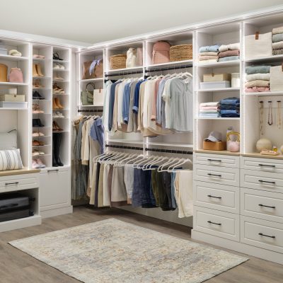 White women's walk-in closet with mood changing lighting from Inspired Closets