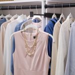 Pull out valet rod for a white women's walk-in closet from Inspired Closets