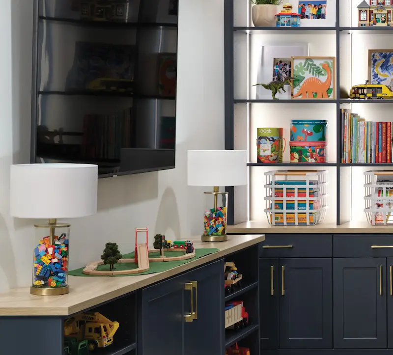 Navy entertianme and wall shelving for kids toy storage from Inspired Closets