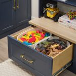 Pull out drawer storage for dino toys and Legos from Inspired Closets