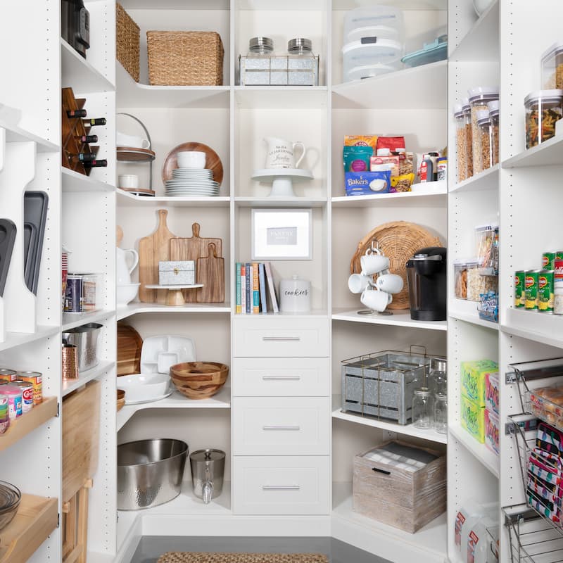 Custom white pantry with drawers and lots of shelves