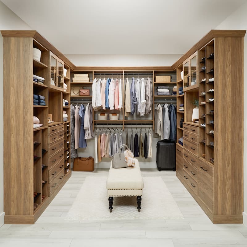 Natural wood brown walk in closet with lighting