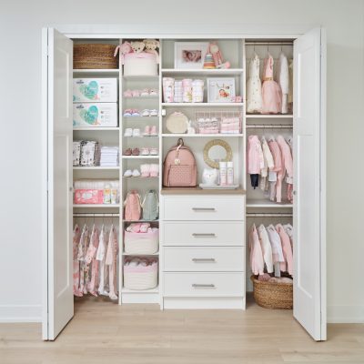Little girls white closet with bulk storage from Inspired Closets
