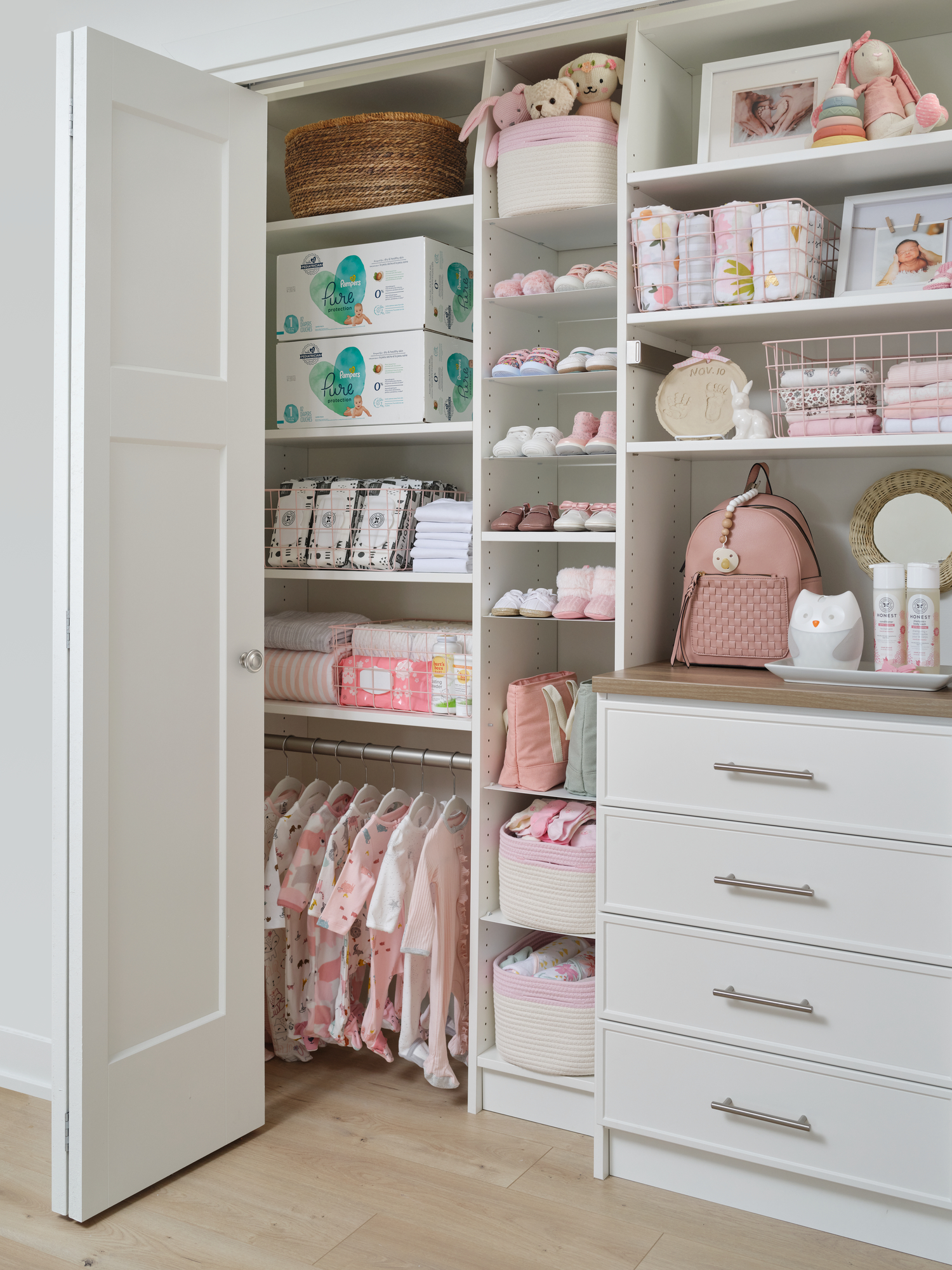 White little girls closet with pull out drawers and shoe storage from Inspired Closets