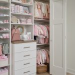 White little girls closet with basket and hanging storage from Inspired Closets