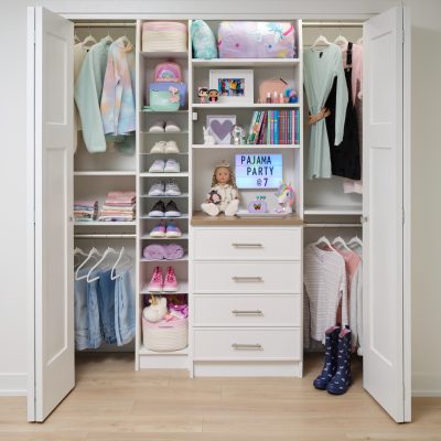 Girls white closet organizer with dress and shirt hanging storage