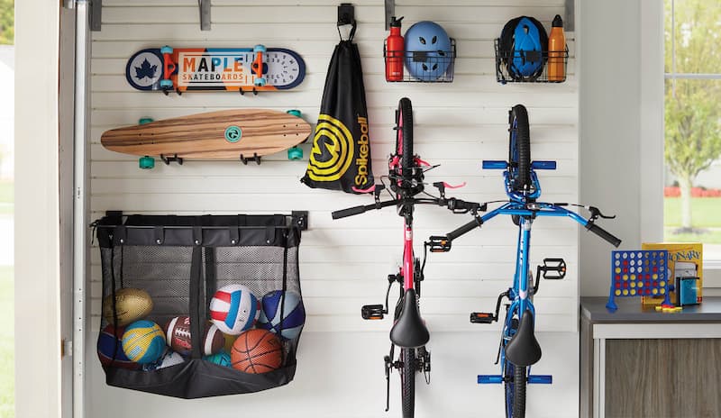 Add _Functionality to your garage by adding slatwall with kids sports gear.