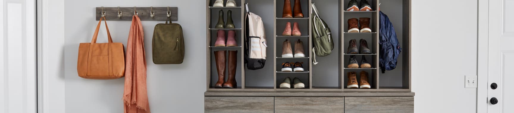 A closet with man shoes aesthetically stacked.