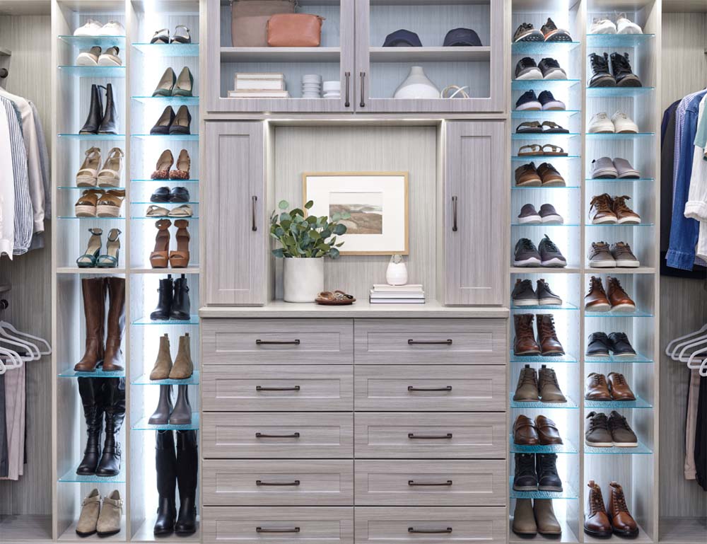 A shoe closet with individual shelves for each pair of shoes, large wardrobe in the center.