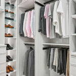 Boutique closet organization with hanging storage and shoe shelves