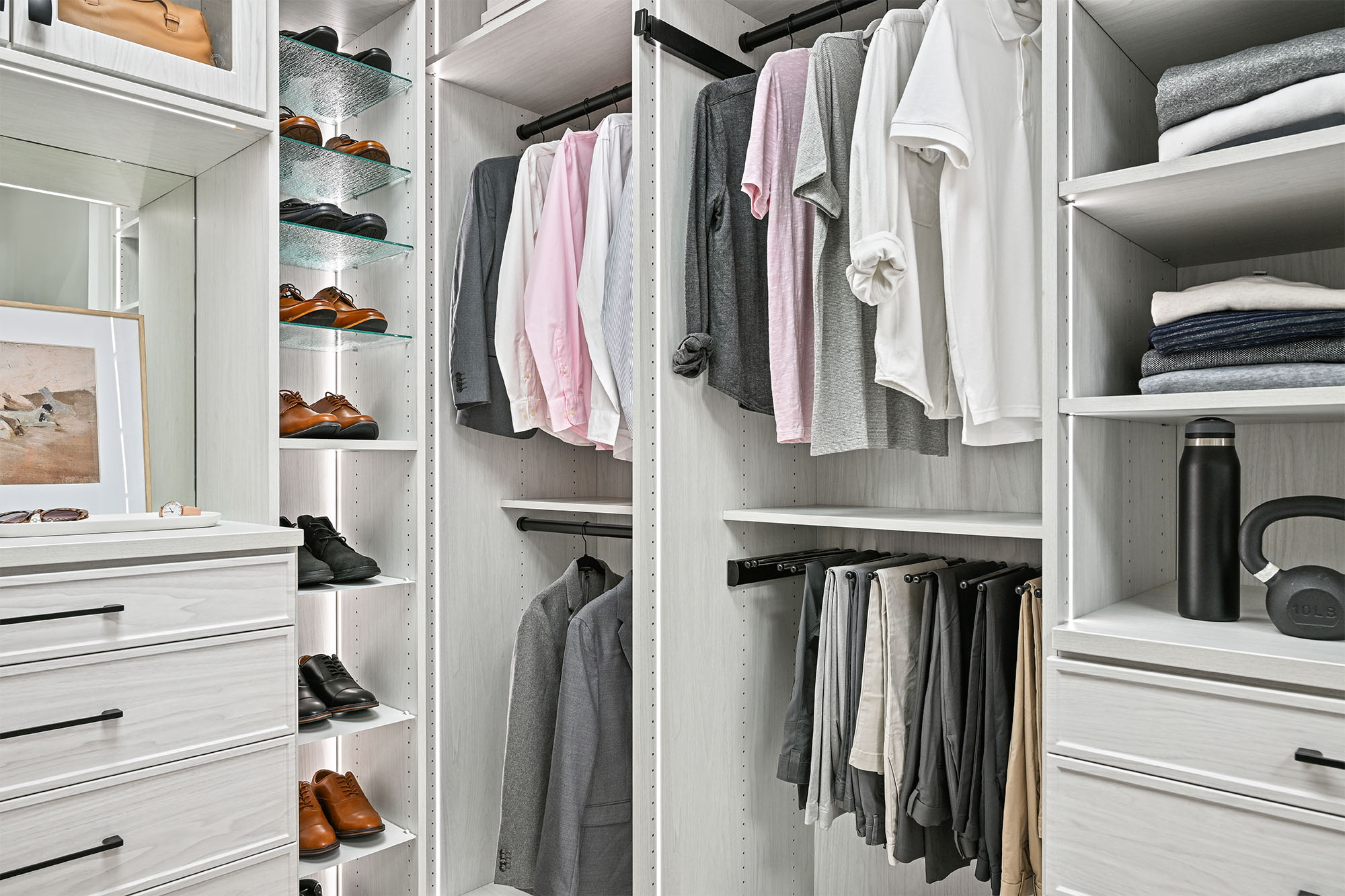 Boutique closet organization with hanging storage and shoe shelves