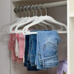 Kids closet with handing storage