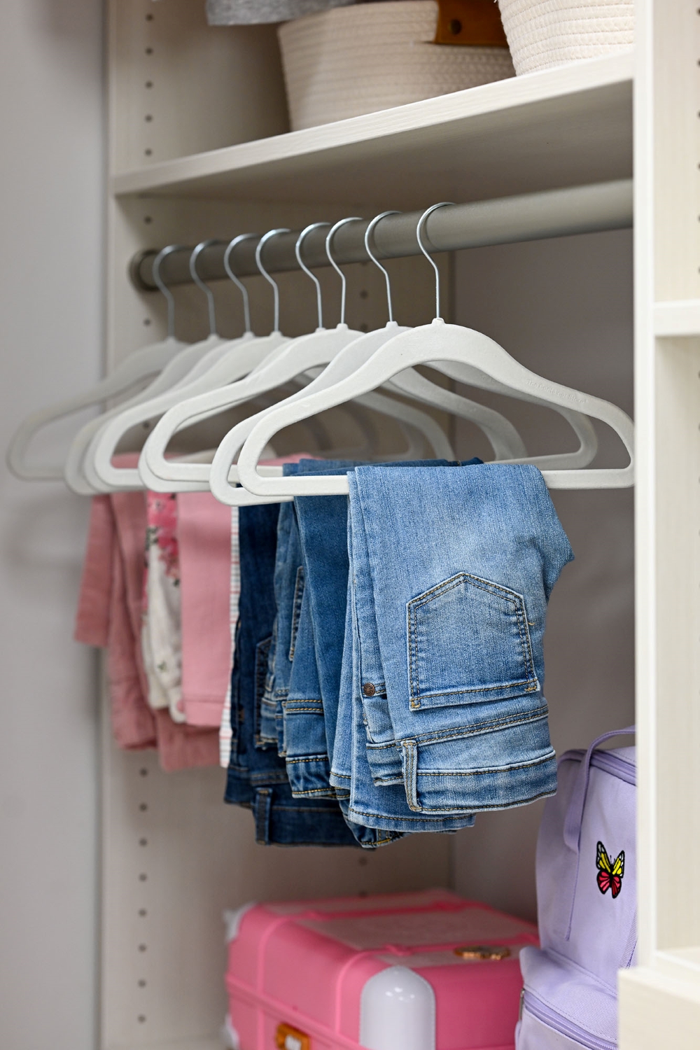 Kids closet with handing storage