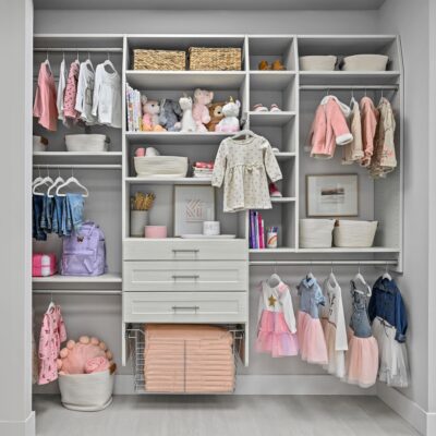 Kid's closet with hanging, shelves, drawers, and wire basket