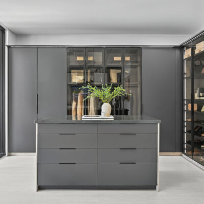 Boutique closet with aluminum glass doors in charcoal