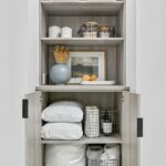 Hallway linen closet with pillow and bedding storage