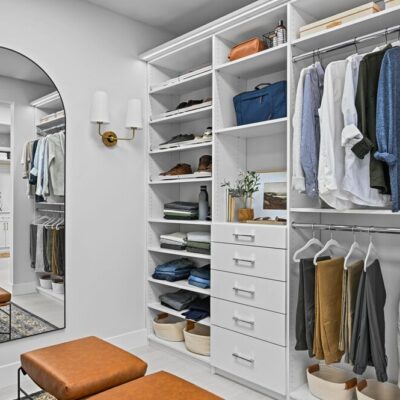 Floor-mounted reach-in closet with hanging and storage