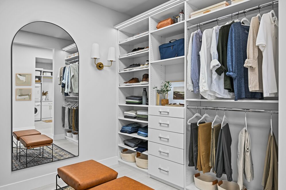 Floor-mounted reach-in closet with hanging and storage