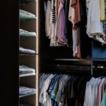 Integrated lighting illuminates an Inspired Closets boutique closet.