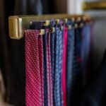 Matte brass pull-out tie rack.
