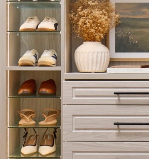 Shoe Shrine with a variety of women's shoes in a light wood-tone closet